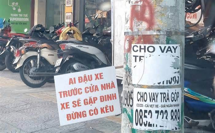 Còng xe đậu ngoài đường, xử phạt thay chính quyền- coi chừng phạm luật!