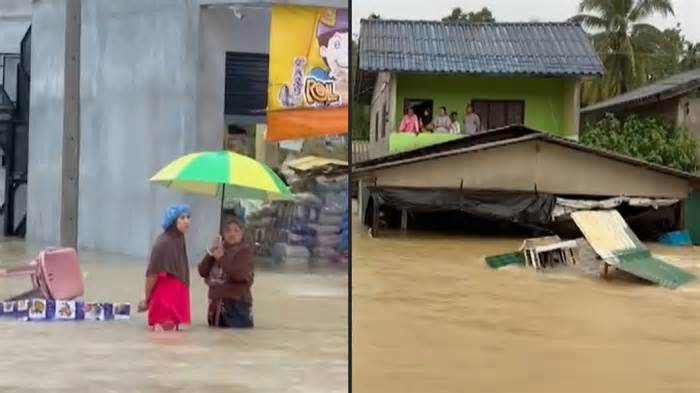 Nước lũ dâng ngập tận mái nhà ở Thái Lan